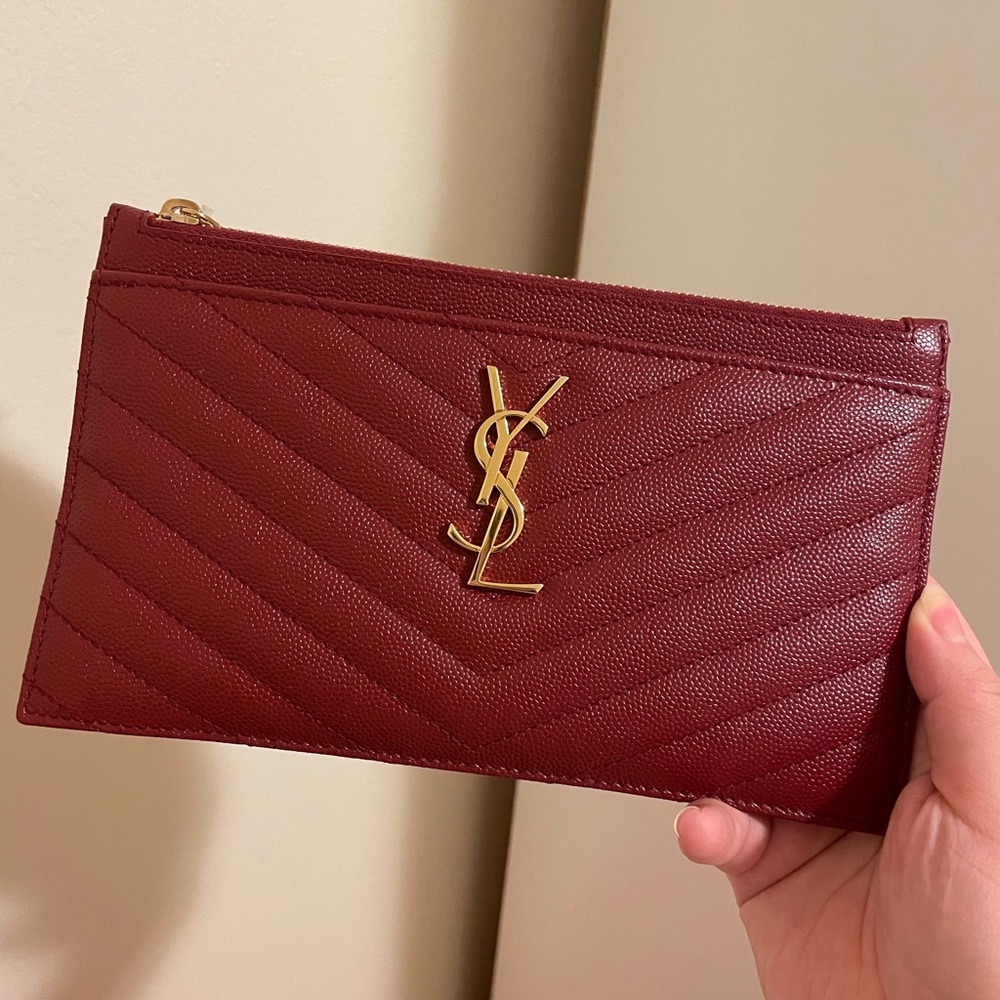 YSL zip pouch! In perfect condition. The hardware is gold. 100% authentic